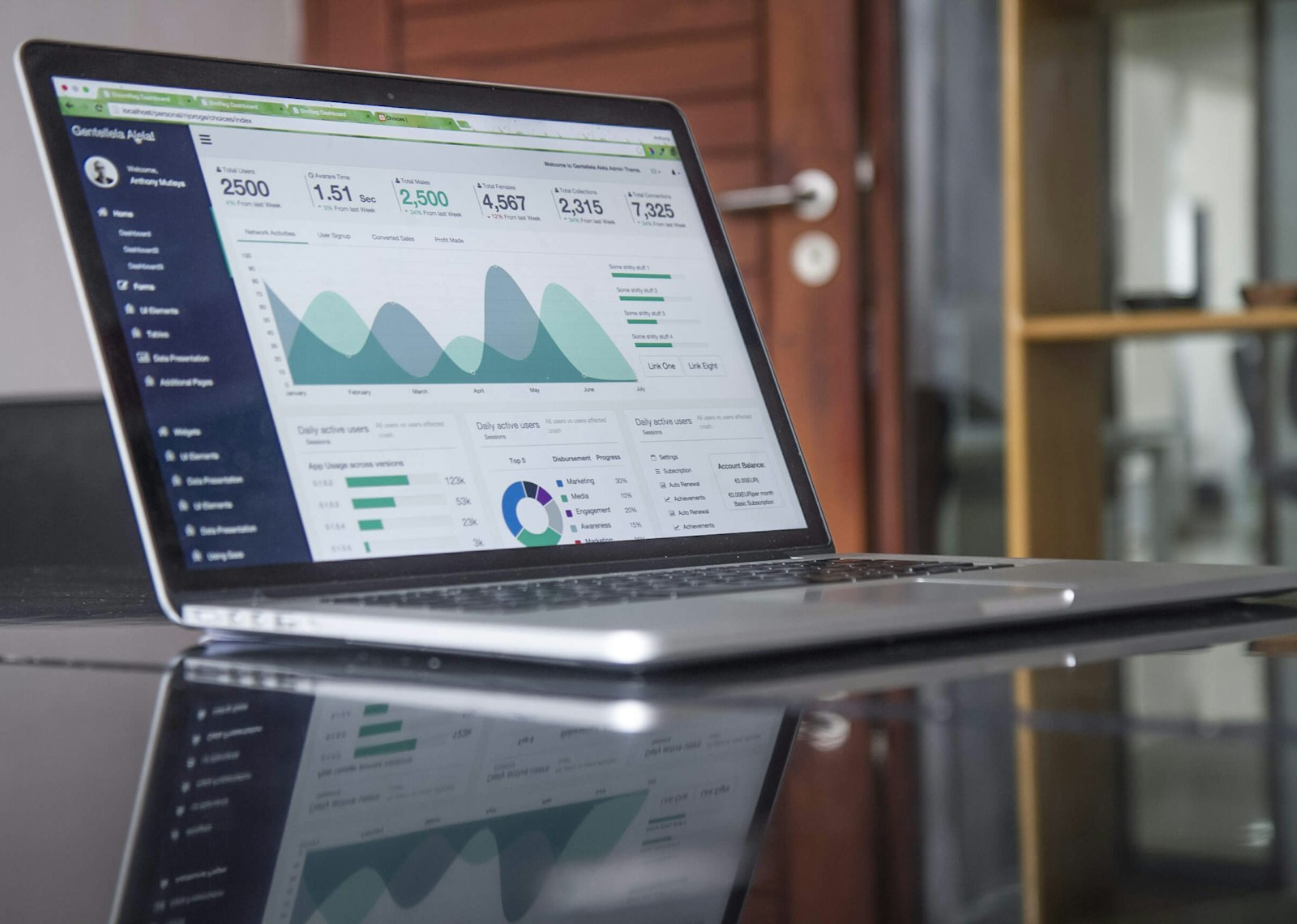 Data analyst workstation with property market datasets and reference maps